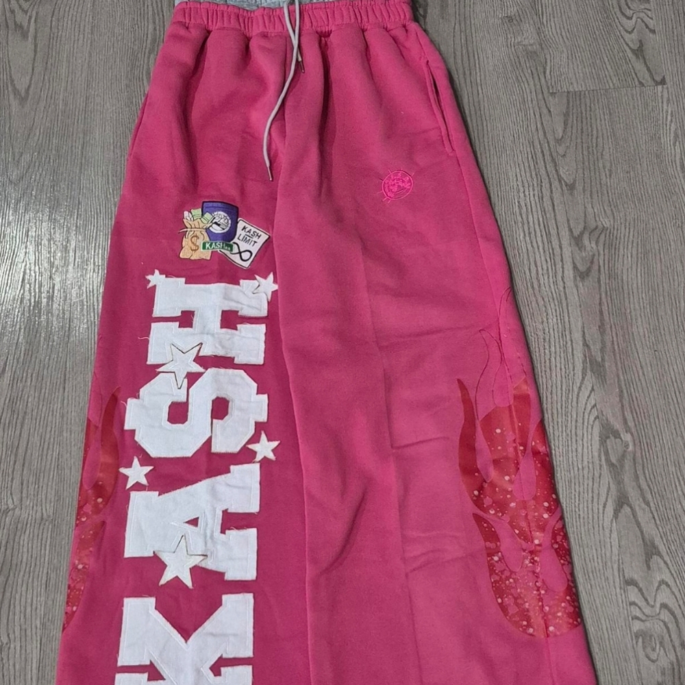 Vibrant Pink Track Pants with Distressed Style
